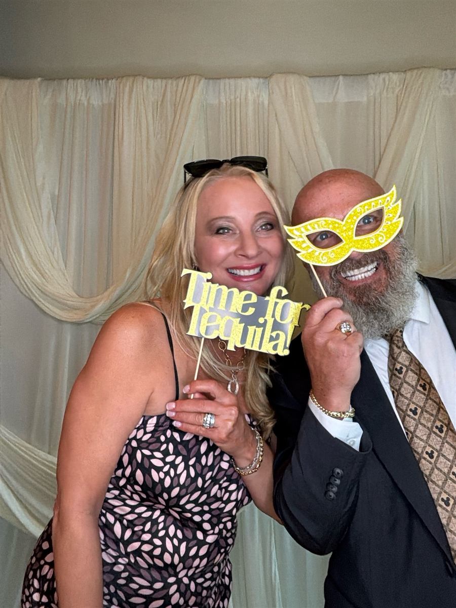 Wedding guests posing with props