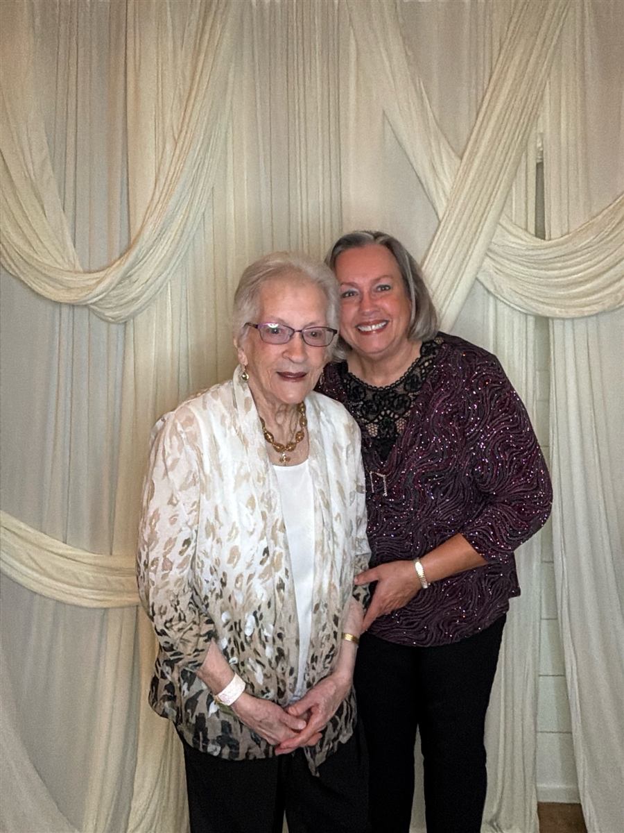 A couple sharing a sweet moment in the photo booth